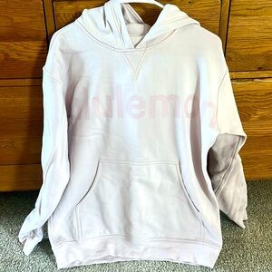 Lululemon Size 8 light pink Hoodie with lululemon printed across the front